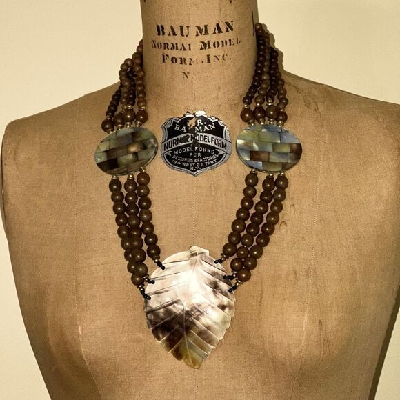 Elegant Brown Wooden Beaded Necklace with Carved Mother of Pearl Leaf Pendant - Picture 1 of 11